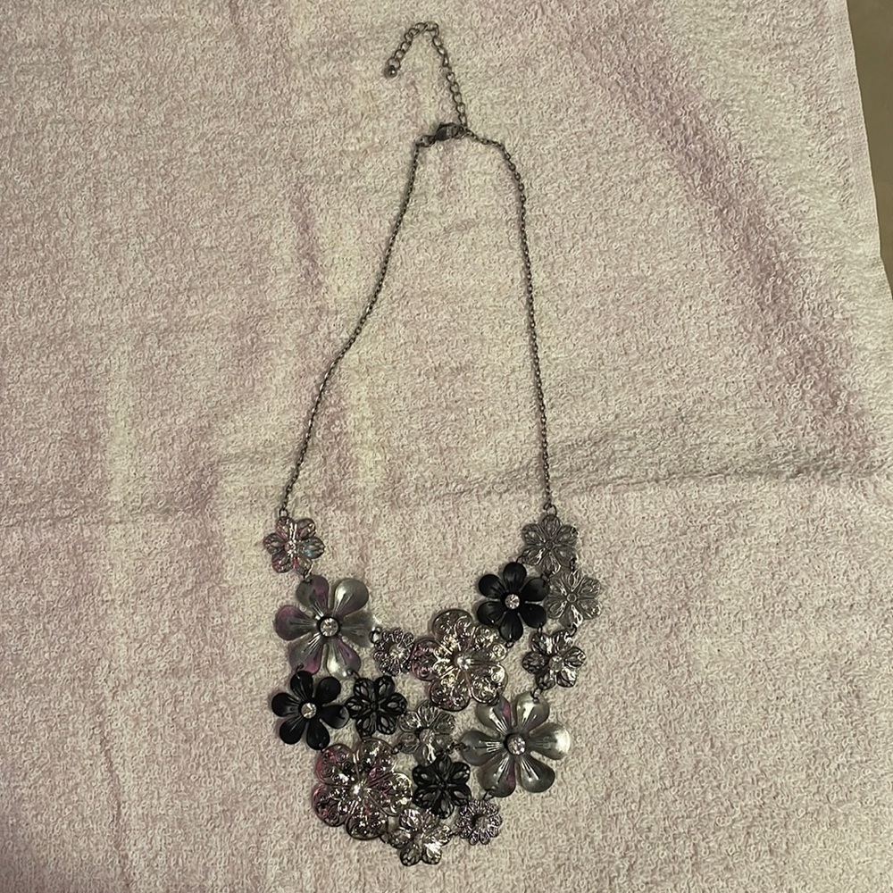 Silver flower choker style necklace, can be worn longer as well